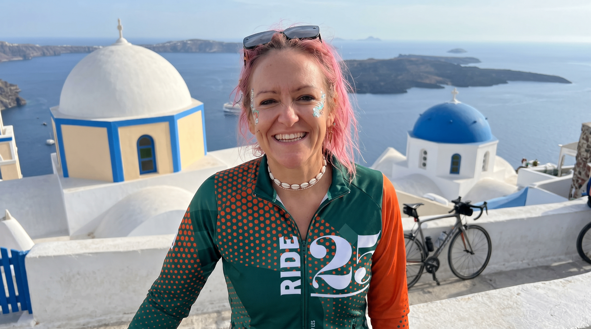 Ride25 rider in Ride25 jersey smiling in Crete, Greece